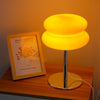 Macaron Glass Table Lamp with trichromatic dimming, modern night light and stylish bedside décor for cozy ambiance.